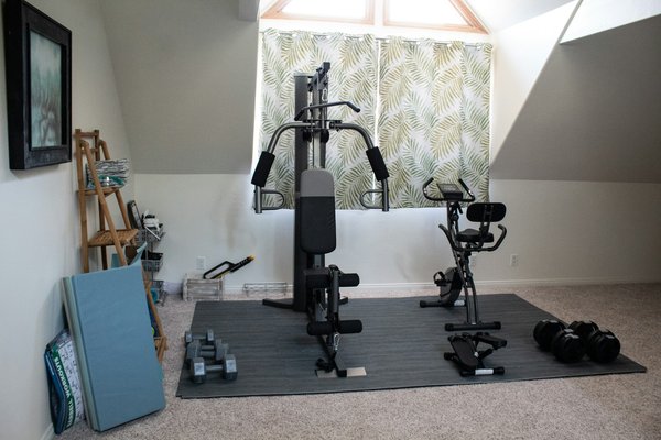 What is the best layout for a home gym in a UK mid-terrace house?